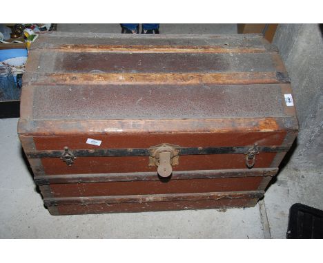 A metal/wooden domed trunk.