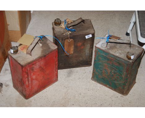 Three vintage fuel cans, one "Esso" and one with "BP" cap, etc.