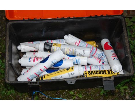 A Tool box with tubes of silicon.