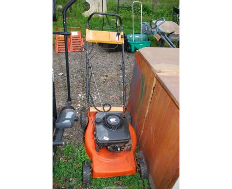 A Lawn mower with Briggs & Stratton engine.