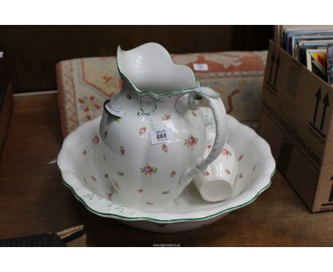 A bedroomware jug and basin, in white with pink roses, etc. as found.
