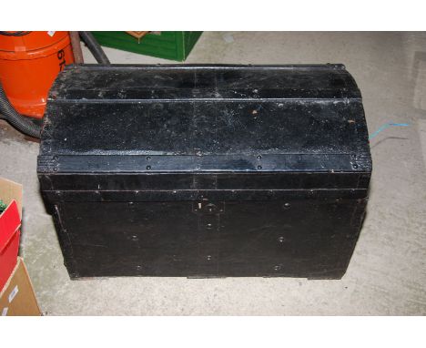 A domed wooden metal bound trunk and contents.