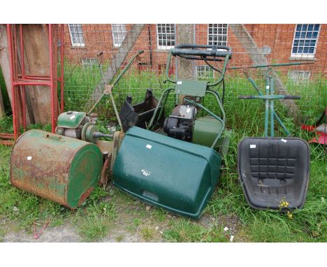 Two cylinder mowers, one with seat and roller, (engine turns) the other (as found).