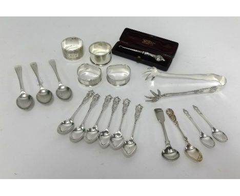 Three silver napkin rings, EP napkin ring, six silver spoons, pair silver spoons, silver button hook, pair of EP tongs and pl