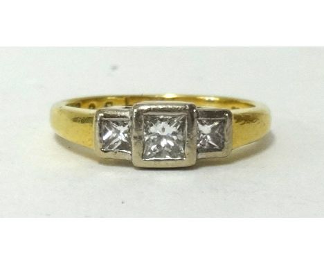 An 18ct diamond three stone ring, ring size J1/2