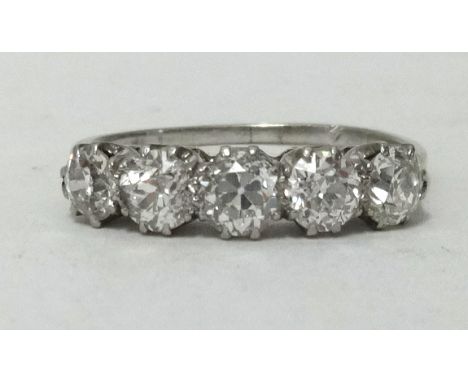 An 18ct platinum diamond five stone ring, total weight approx 1.67cts, with copy of insurance valuation dated 1991 for £3,240