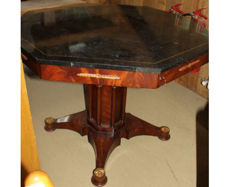 A modern octagonal centre table with marble and brass inlaid top to architectural pedestal on quadraped base with ormolu styl