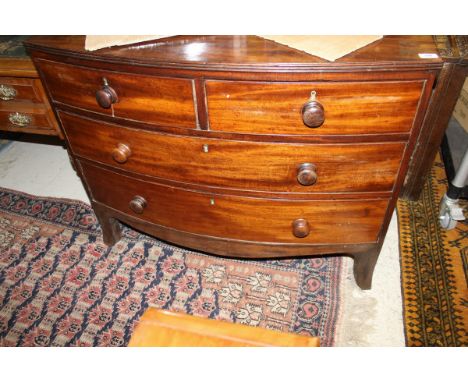 A 19th Century mahogany bow fronted chest of two short over two long drawers to splayed feet