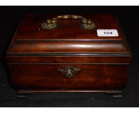 A late George III mahogany tea caddy of bombé sarcophagus form with lacquered brass ornate swan neck handle opening to reveal