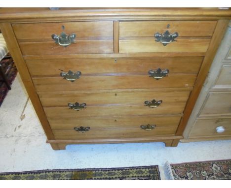 An Edwardian satin walnut chest of two short above three long drawers to bracket feet