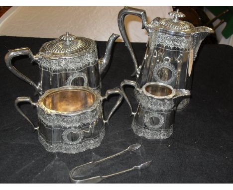 An electro-plated silver four piece tea and coffee service of tapering form with foliate engraving  (by Walker & Hall, Sheffi