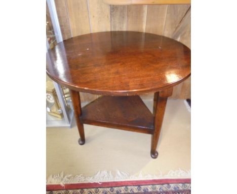 A oak cricket table together with a 19th Century oak panel seated elbow chair and an Edwardian mahogany and inlaid comb back 