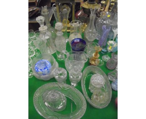 A four section cut glass decanter with star cut base, a further four section decanter of baluster form, two further decanters