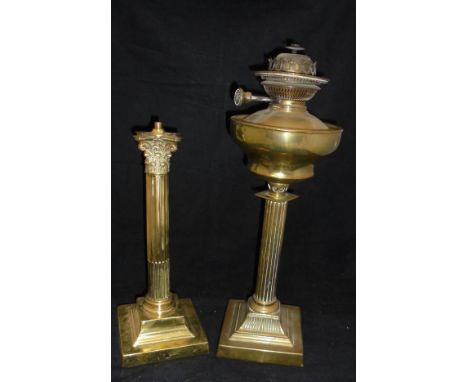 A brass table lamp base in the form of a Corinthium column on a stepped base, together with a Victorian oil lamp base the wel