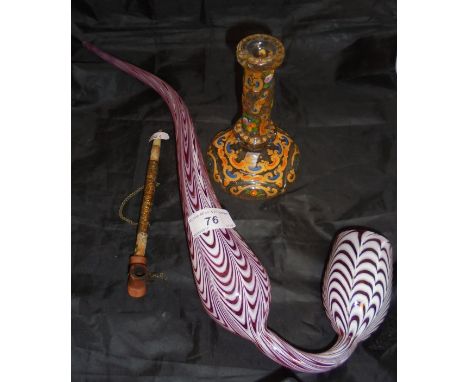 A Nailsea glass pipe with white enamel on a cranberry ground together with a Turkish glass candlestick and a pipe   CONDITION