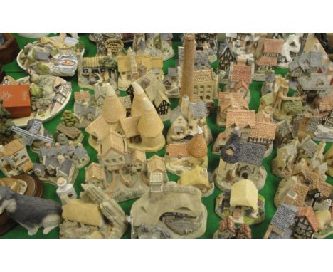 A collection of David Winter cottage and other ornaments including "Fairytale Castle", "Horatio Pernickety's Amorous Intent",