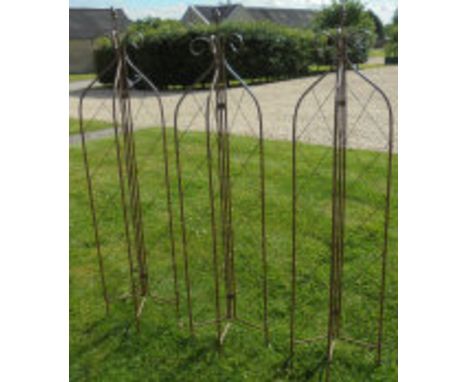 Three five foot folding iron garden spires*