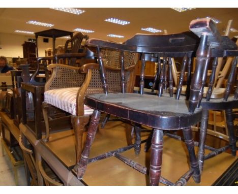 Four Ercol stick back chairs with elm seats and beech frames, a 20th Century mahogany framed ladder back rocking chair, three