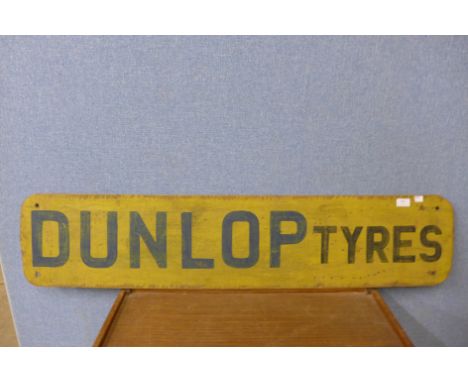 A painted Dunlop Tyres sign