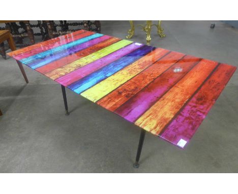 A 1960's style coloured glass coffee table