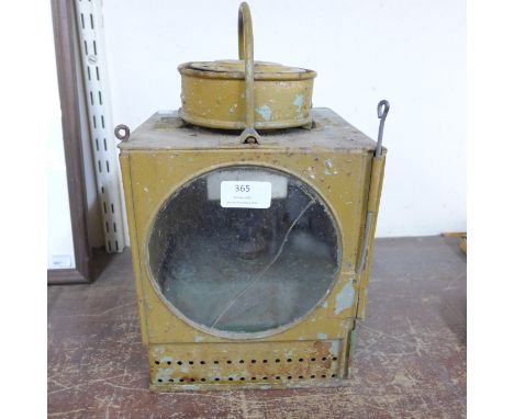 A painted metal railway signal lamp