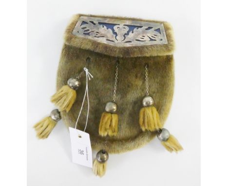 A vintage leather and seal fur sporran with thistle engraved white metal mounts 