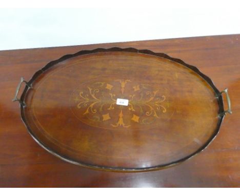 Mahogany and inlaid oval tray with brass handles, 68 x 43cm, together with a brass framed fire screen, (2) 