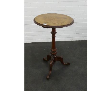 A circular walnut side table raised on baluster column and tripod legs , 72 x 45cm