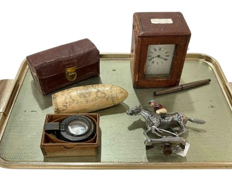 Tray lot with French carriage clock, steeplechase car mascot, reel, compass, pen and replica scrimshaw (6).