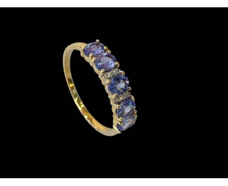 10k/9carat gold blue stone (tanzanite) and diamond ring, size S.