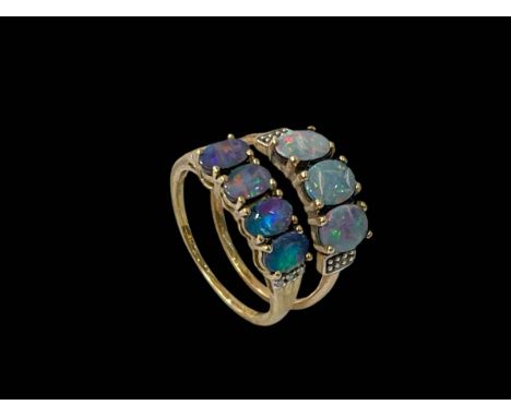 Two 10k gold opal veneered rings.