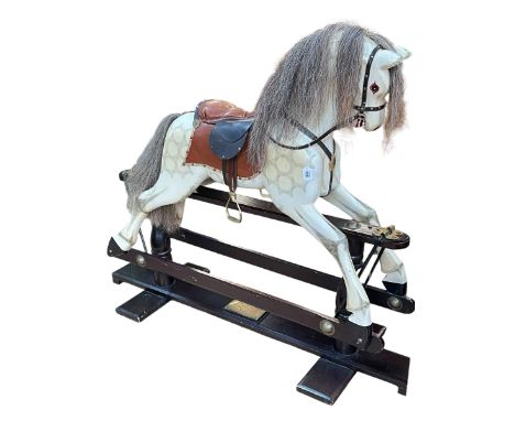 Limited edition sponge painted Millennium rocking horse with leather saddle, number 448 of 500, 124cm by 150cm.