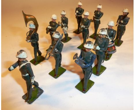 * Britains set 2117, Band of the U.S. Army in Steel helmets (G-F, bass drummer missing, extra side drummer added, four damage