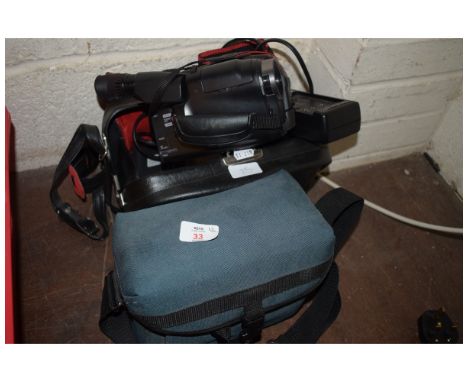 POLAROID CAMERA TOGETHER WITH A JVC COMPACT VIDEO CAMERA 