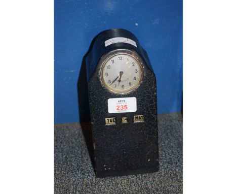 METAL FRAMED CLOCK WITH CIRCULAR DIAL STAMPED "FOREIGN" TOGETHER WITH A MANUAL BAIT CHANGE 