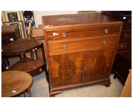 EARLY 20TH CENTURY MAHOGANY SIDE CUPBOARD WITH TWO DRAWERS OVER TWO PANELLED CUPBOARD DOORS WITH RINGLET HANDLES RAISED ON BR