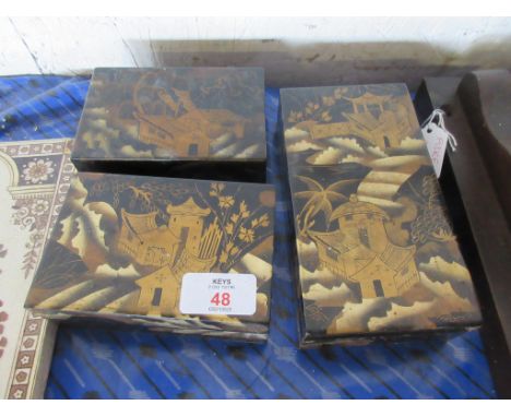 THREE SMALL ORIENTAL WOODEN TRINKET BOXES, EACH WITH PAINTED DECORATION ON A JAPANNED GROUND, LARGEST APPROX 17CM LONG