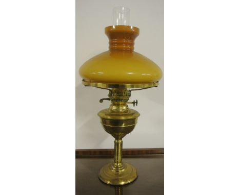 ANTIQUE/ HOME - A beautiful brass oil lamp with orange/brown glass shade. Measures