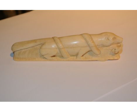 IVORY/ BONE - An antique carved ivory walking stick grip in the form of a mongoose with a cobra in its jaws. Measures 12cm lo