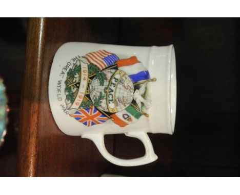 MILITARIA - An original WW1 ceramic 'Peace' cup, with transfer prints to each side, commemorating the end of WW1.
