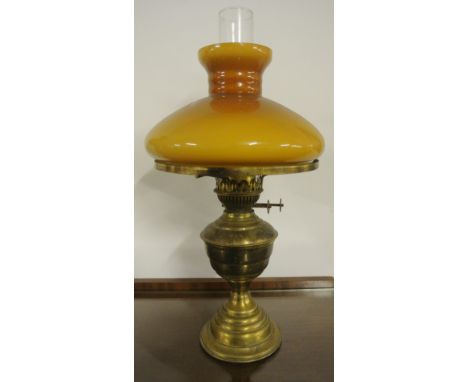ANTIQUE/ HOME - A beautiful brass oil lamp with orange/brown glass shade. Measures