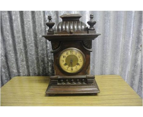 ANTIQUE/ CLOCK - An antique wooden cased mantel clock, with Junghans movement, in working condition, though case requires som