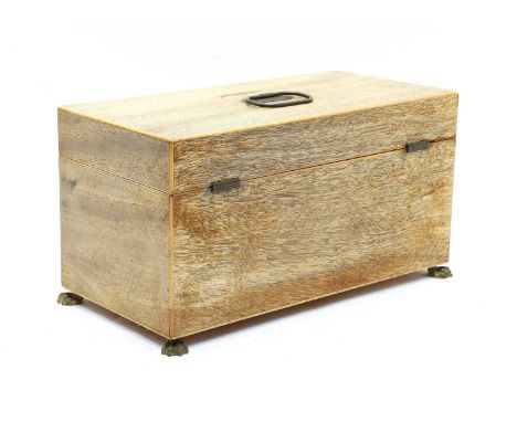 A George III inlaid mahogany tea caddy, the rectangular hinged top enclosing twin canister and a central division for a mixin