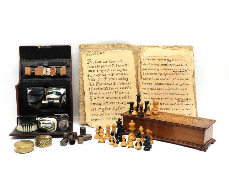 A mahogany games box, early 20th century, with a cribbage board lid, enclosing a boxwood chess and draughts set, king 5.6cm h