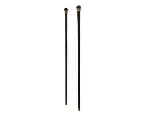 A silver-mounted walking stick, late 19th/ early 20th century, with a spherical agate handle above a tapering ebonised shaft,