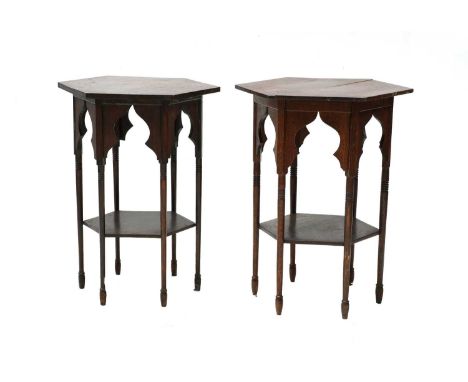 A near pair of Liberty style Moorish oak side tables, circa 1910, each with a hexagonal top over a shelf, raised on ring turn