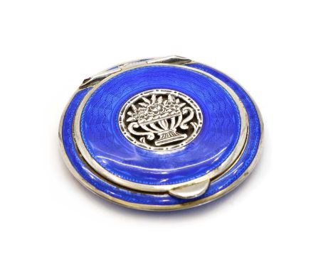 An Austrian Art Deco enamelled sterling silver compact, of flattened discus form, externally with a blue guilloche enamel wit