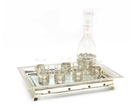 A silver mounted and glass drinks set, London 1903, William Comyns, comprising a decanter and six cups all with pierced silve