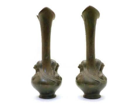 A pair of Art Nouveau spelter vases, signed Helene Sibend, the elongated necks with naturalistic detail, the bulbous body wit