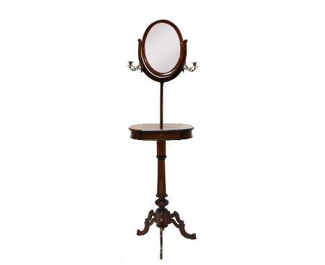 A Victorian burr walnut shaving stand, with an oval mirror, a pair of candle scones, a drawer to the shelf on fret cut tripod